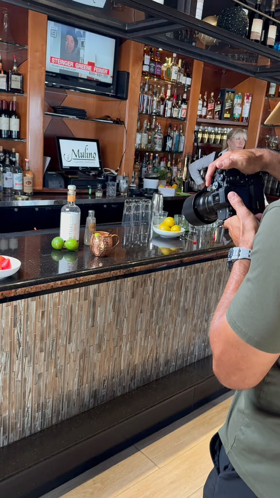 Behind the scenes during a brand photoshoot at a bar